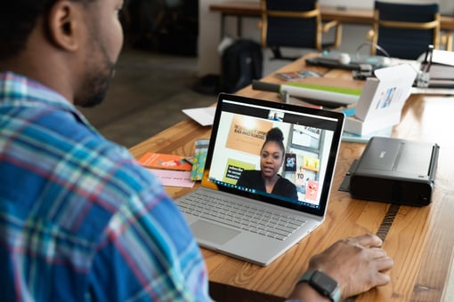 ATSI About Our Product GoTo Connect Man on Video Conference on Laptop